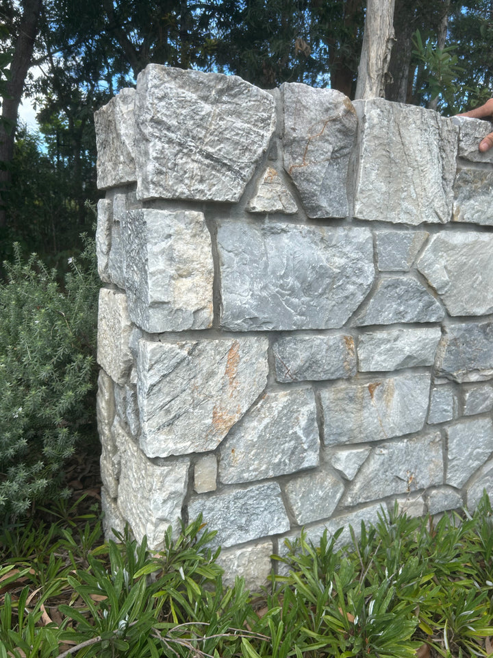 Free-form loose stone wall cladding in grey limestone